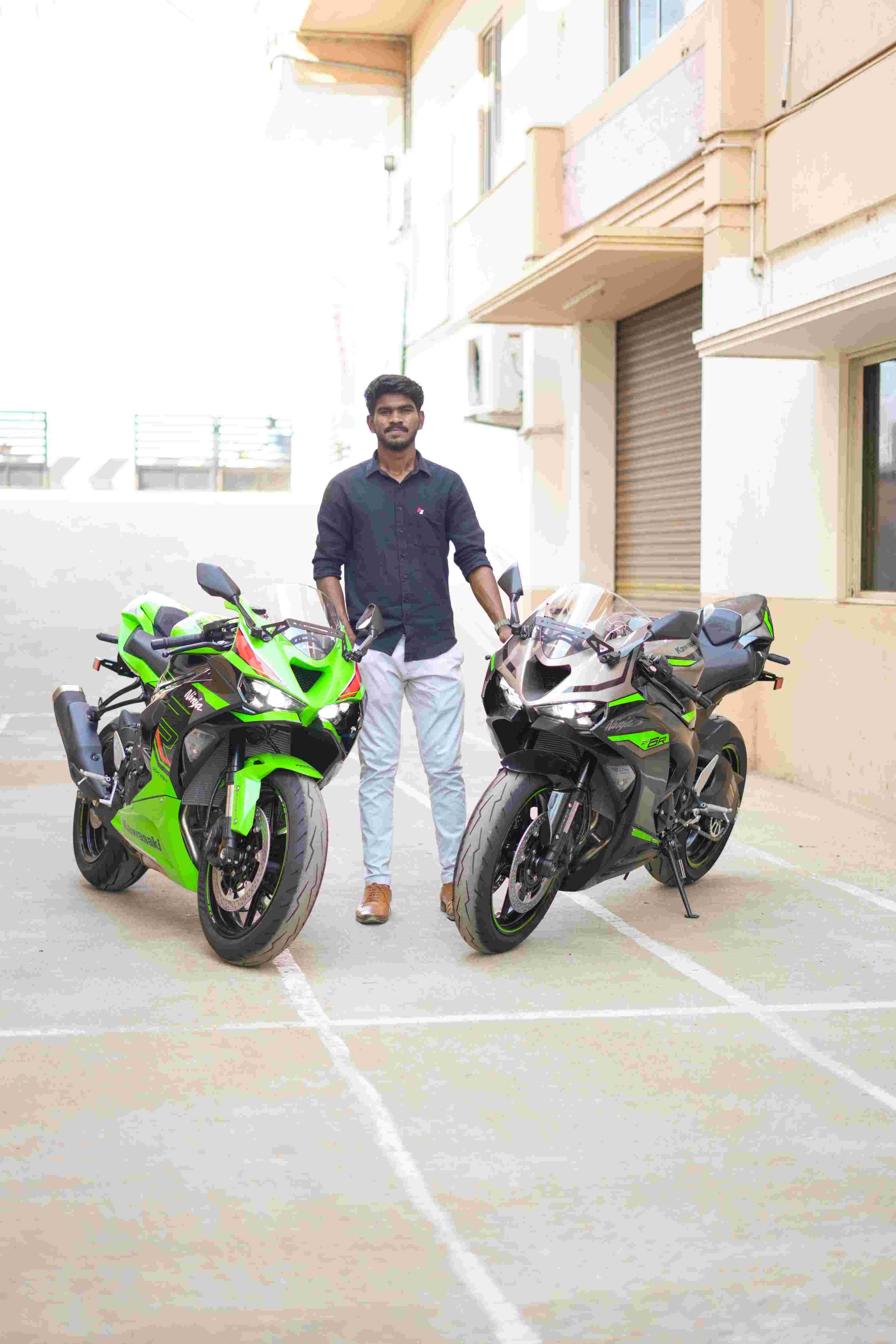 Sports bikes parked with rider standing